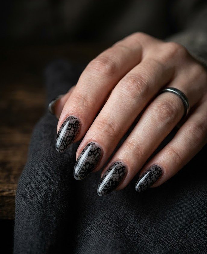 Black doily lace pattern on sheer smoky nails