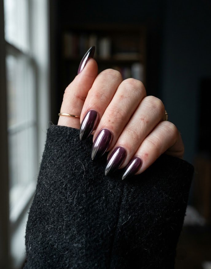 Chrome-sealed plum to black ombre on long almond nails