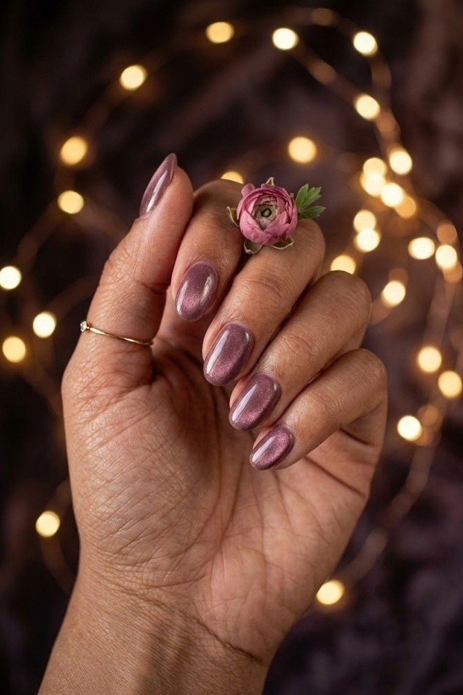 Dusty mauve-plum velvet nails on short squoval nails with a gentle shimmer