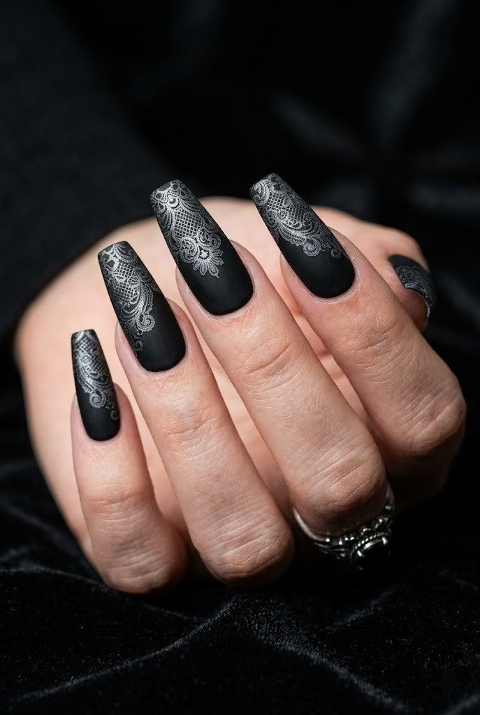 Gothic black-on-black lace nails, matte base with glossy black lace overlay