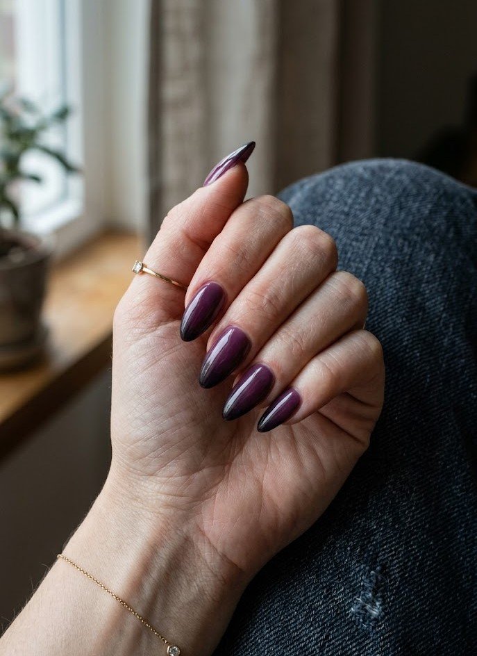 Plum to black ombre gradient on long almond nails