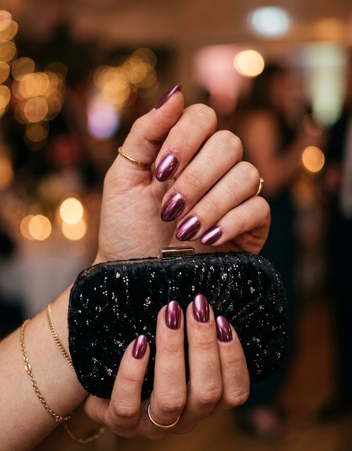 Plum chrome press-on nails in short almond shape