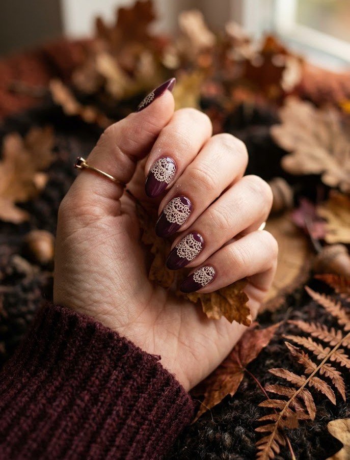 Deep plum nails with cream doily pattern for fall