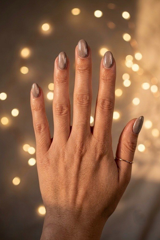 Warm greige taupe velvet nails on short soft almond nails with a gentle shimmer