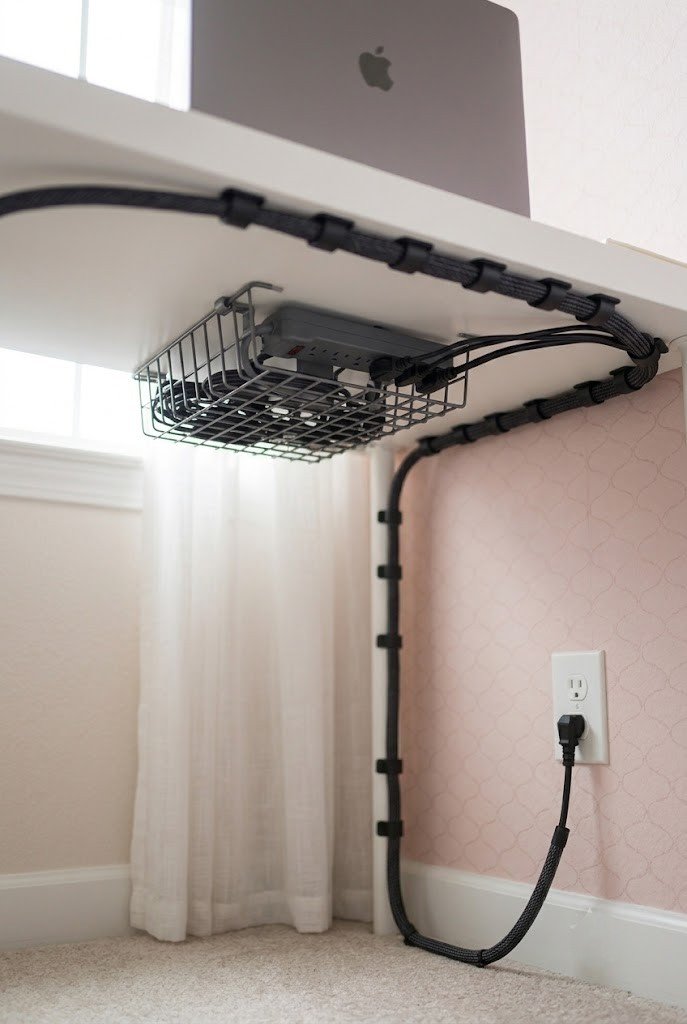 No-drill under-desk cable tray hiding a power strip on a small desk